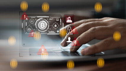 Hands typing on laptop keyboard with ransomware alert, bitcoin payment interface, and cybersecurity...