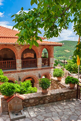 Brick and stone monastery building with potted plants  in Meteora Greece