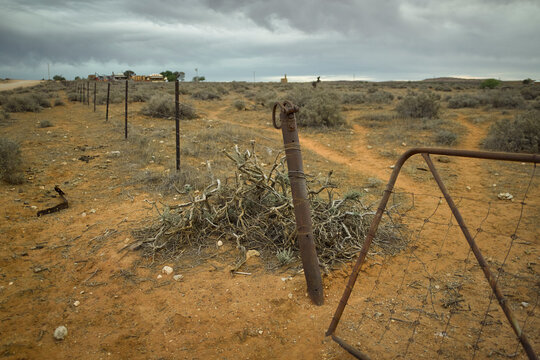 Broken gate and fence line in the outback