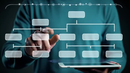 Man Interacts With Digital Organization Chart on Tablet with Teal Sweater against Dark Background Using Innovative Touch Technology for Strategic Management