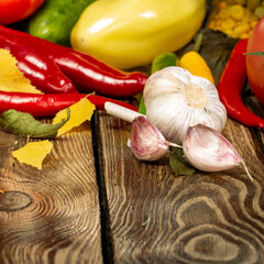 Fresh spring, summer and autumn vegetables on a rustic wooden table with copy space – healthy seasonal food and natural lifestyle concept.