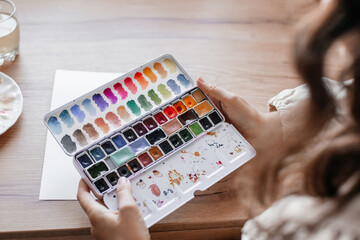 Independent Artist Day Artist Holding Watercolor Palette Capturing Creative Process