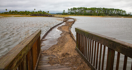 Fototapeta premium A boardwalk over the salt marsh after a hurricane's surge in northeast Florida