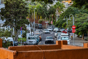 Cars drive along a road on the island of Tenerife on a summer evening	
