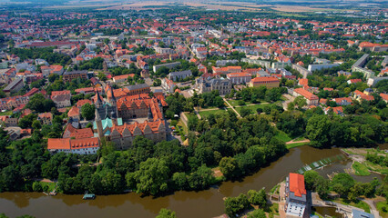 A panorama Aerial view around the old town above the city Merseburg on an sunny summer noon in Germany.