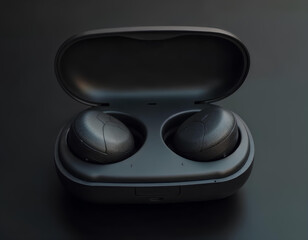 Close-up of black wireless earbuds in their charging case against a dark backdrop.