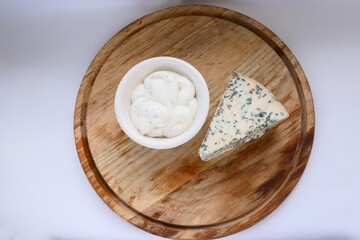 Creamy Dorblu Sauce and Cheese Wedge on Wooden Board as an Aesthetic Accent for Gourmet Recipes and Premium Food Content