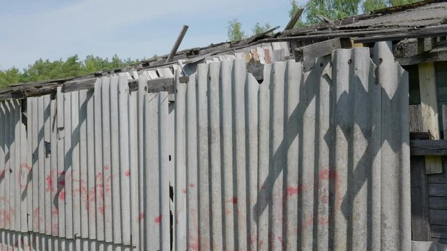 Old and very dangerous asbestos roof. Asbestos dust in the environment. Asbestos removal