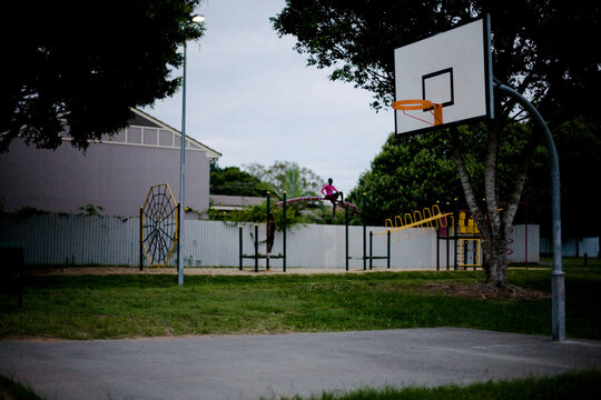 Little girl plays in suburban playground.