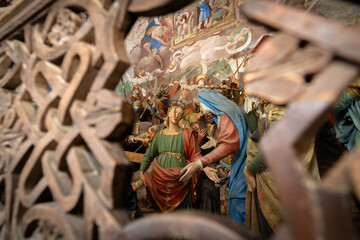 Intricate Religious Art Depicts A Biblical Scene Through Decorative Wooden Frame