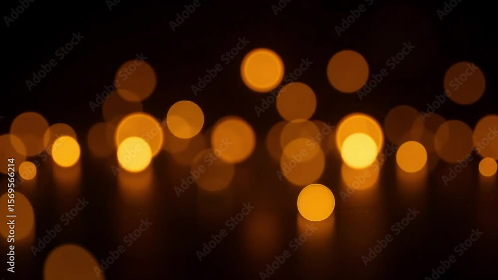 Poster A blurry view of golden bokeh lights scattered across a dark background creating a warm ambiance effect