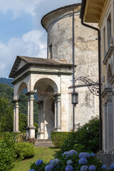 Historic Stone Structure with Arches and Rustic Garden in Daylight