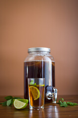 Natural fermented drink with mint and citrus on wood background