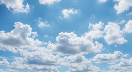 Obraz premium Blue sky with puffy clouds forming patterns, vibrant color tones, serene and minimalistic view, ideal for advertising and design space