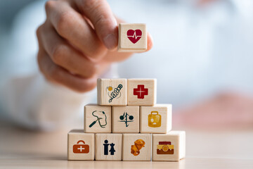 Health Care Concept: Stacked Wooden Blocks with Medical Icons and Heart Symbol