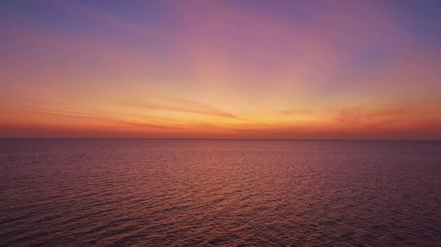 Amazing sunset sky over ocean,Nature beautiful light sunset or sunrise over sea,Colorful dramatic majestic scenery sunset Sky with Amazing clouds and waves texture colorful sky cloud background