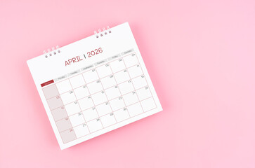 April desk calendar for 2026 year on pink background for schedule to make appointment meeting.