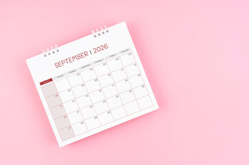 September desk calendar for 2026 year on pink background for schedule to make appointment meeting.