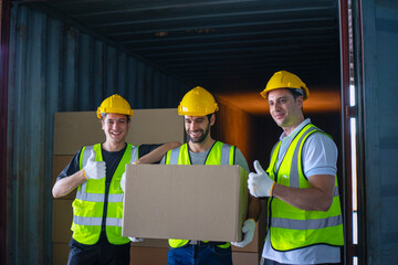 Blue collar workers are working at warehouse.