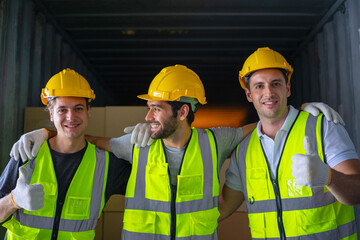Blue collar workers are working at warehouse.