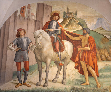 FLORENCE, ITALY - MARCH 17, 2025: The renaissance fresco of St. Martin in church Badia Fiorentina by unknown artist.