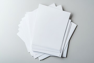 TopDown View Stack of White Printer Paper Sheets on Neutral Light Grey Surface
