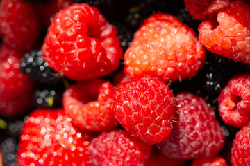 Background of red ripe raspberry berries.