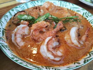 Thai Chu Chee Curry with Grilled Shrimp in Red Coconut Sauce and Kaffir Lime Garnish