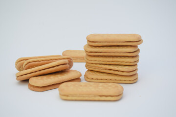 Stacked sandwich cookies on a white background.