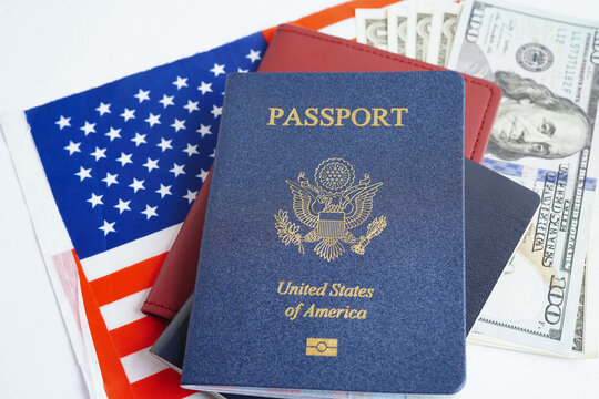 US passport issued to citizen and national of the United States of America to travel in most countries outside with USA flag and dollar money.