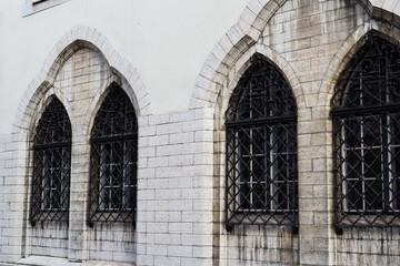 Naklejka premium Gothic Arch Windows with Wrought Iron Grates in Tallinn Old Town