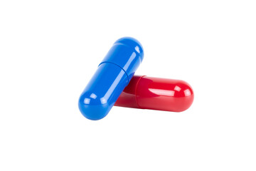 A red pill and a blue pill, representing a difficult choice or dilemma. A concept for decision, reality, and pharmaceutical medicine, isolated on white background with clipping path.