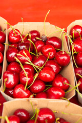 cherries in eco-friendly paper boxes for sale.