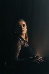 A mysterious woman stands in silhouette against a bright window, surrounded by dramatic smoke and...