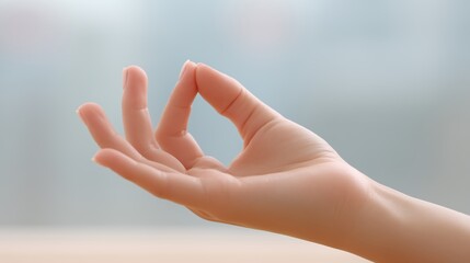 Yoga and meditation class indoor, Hand gesture symbolizing peace and meditation.