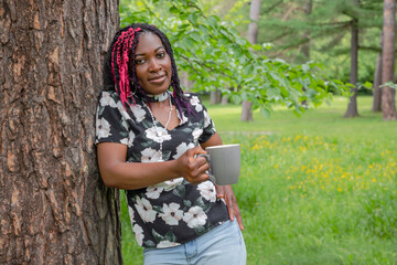Black Woman Drinking Coffee in Nature Outdoor Relaxation