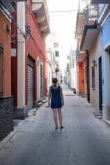 woman tourist walking in quiant old town