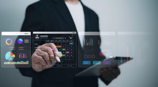 Professional using interactive calendar smart dashboard visual report KPI pie chart data visualization digital interface for planning schedule strategy and productivity