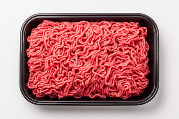 Ground beef in black carton tray in groceries mart isolated on white background, Selective focus minced pork for cooking ingredient in butcher shop.