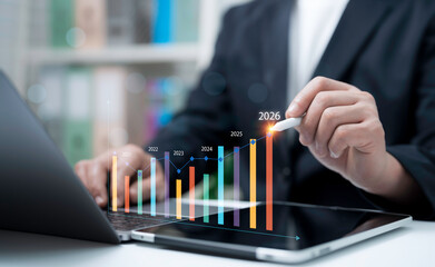 Businessman analyzing future growth trend with interactive bar chart from 2021 to 2026 showing data analytics finance performance forecast planning technology investment