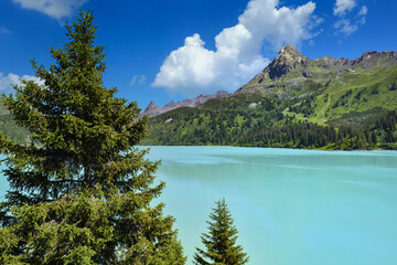 Reservoir lake with mountains epic landscape. Idyllic reservoir Kops lake at 1800 m in austrian Galtur, Vorarlberg