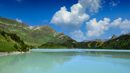 Reservoir lake with mountains epic landscape. Idyllic reservoir Kops lake at 1800 m in austrian Galtur, Vorarlberg