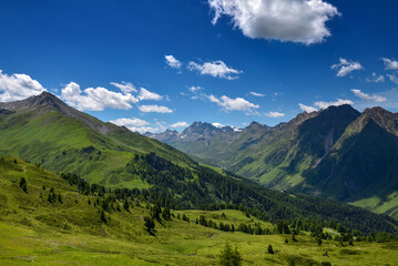 Rocky peaks in the Tirol Alps. Scenic mountain landscape with blue sky with clouds. Austria. Europe