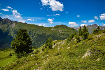 Rocky peaks in the Tirol Alps. Scenic mountain landscape with blue sky with clouds. Austria. Europe