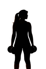 silhouette of young woman with dumbbells along body on white isolated background, girl engaged in sport