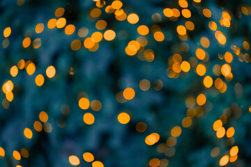 Christmas unfocused festive lights golden sparkles garland abstraction in dusk environment space background wallpaper concept