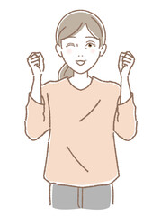 両手の拳をあげて応援する中高年女性