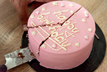 Pink house made cake with inscription message for birthday girl three years old