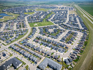 Residential area with many houses and a few cars