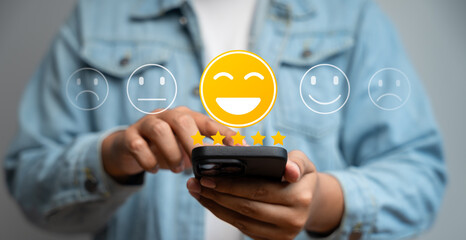 Happy customer providing 5-star review via mobile application after receiving outstanding service and quality product. Online customer feedback plays crucial role in business ranking, Consumer trust